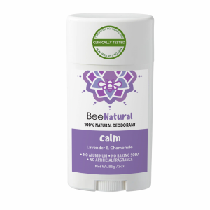A deodorant stick from the brand "BeeNatural." The deodorant is called "calm" and is labeled as "100% NATURAL DEODORANT." The product features a lavender label with text listing the scents "Lavender & Chamomile" and states "NO ALUMINUM • NO BAKING SODA • NO ARTIFICIAL FRAGRANCE." The label also says "Non-Irritant To Skin," "Clinically Tested," and "Certified By SGS IDEAS Clinic." The weight is listed as "Net Wt. 85g / 3oz." The packaging is a white twist-up style stick with a white cap.