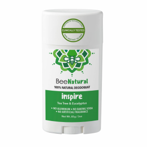 A deodorant stick from the brand "BeeNatural." The deodorant is called "inspire" and is labeled as "100% NATURAL DEODORANT." The product features a green label with text listing the scents "Tea Tree & Eucalyptus" and states "NO ALUMINUM • NO BAKING SODA • NO ARTIFICIAL FRAGRANCE." The label also says "Non-Irritant To Skin," "Clinically Tested," and "Certified By SGS IDEAS Clinic." The weight is listed as "Net Wt. 85g / 3oz." The packaging is a white twist-up style stick with a white cap.