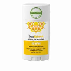 A deodorant stick from the brand "BeeNatural." The deodorant is called "joyful" and is labeled as "100% NATURAL DEODORANT." The product features a yellow label with text listing the scents "Tangerine & May Chang" and states "NO ALUMINUM • NO BAKING SODA • NO ARTIFICIAL FRAGRANCE." The label also says "Non-Irritant To Skin," "Clinically Tested," and "Certified By SGS IDEAS Clinic." The weight is listed as "Net Wt. 85g / 3oz." The packaging is a white twist-up style stick with a white cap.